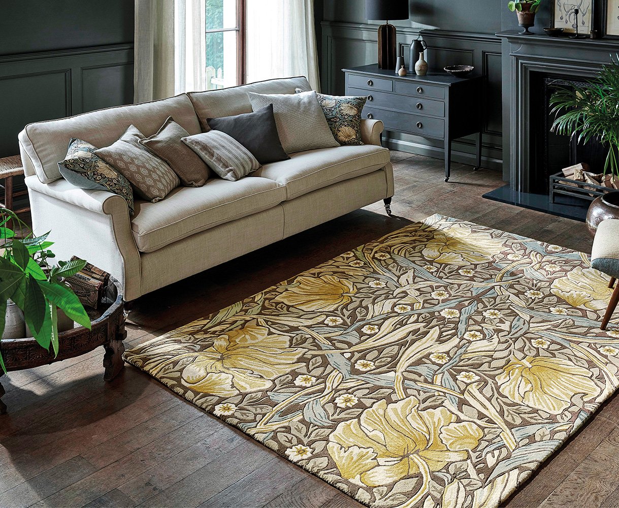 Floral rug beside a cream sofa in a living room